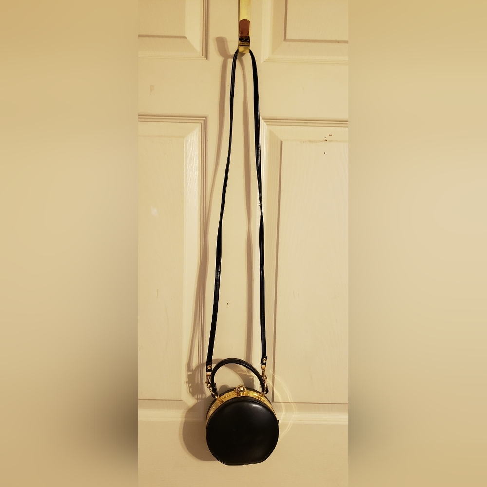 No brand small, round purse with shoulder strap